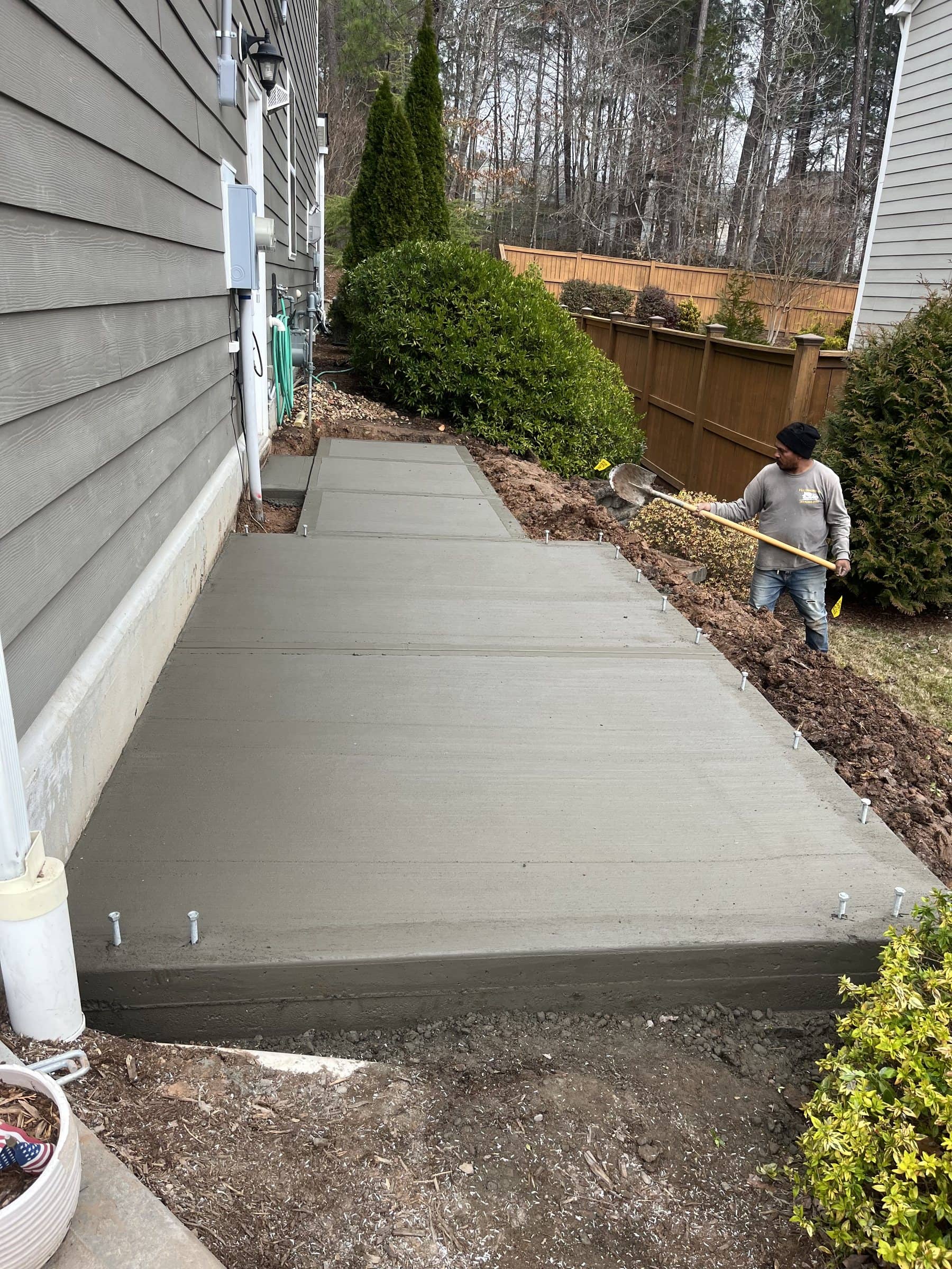 Stepped side walkway being finished at a home in Durham, NC